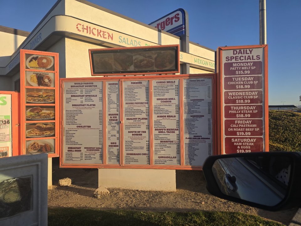Counter service area with menu boards overhead.