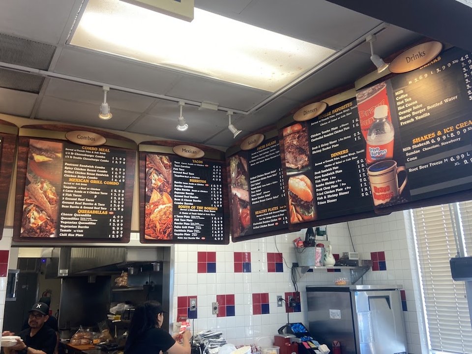 Menu board showing hot cakes and omelette options.
