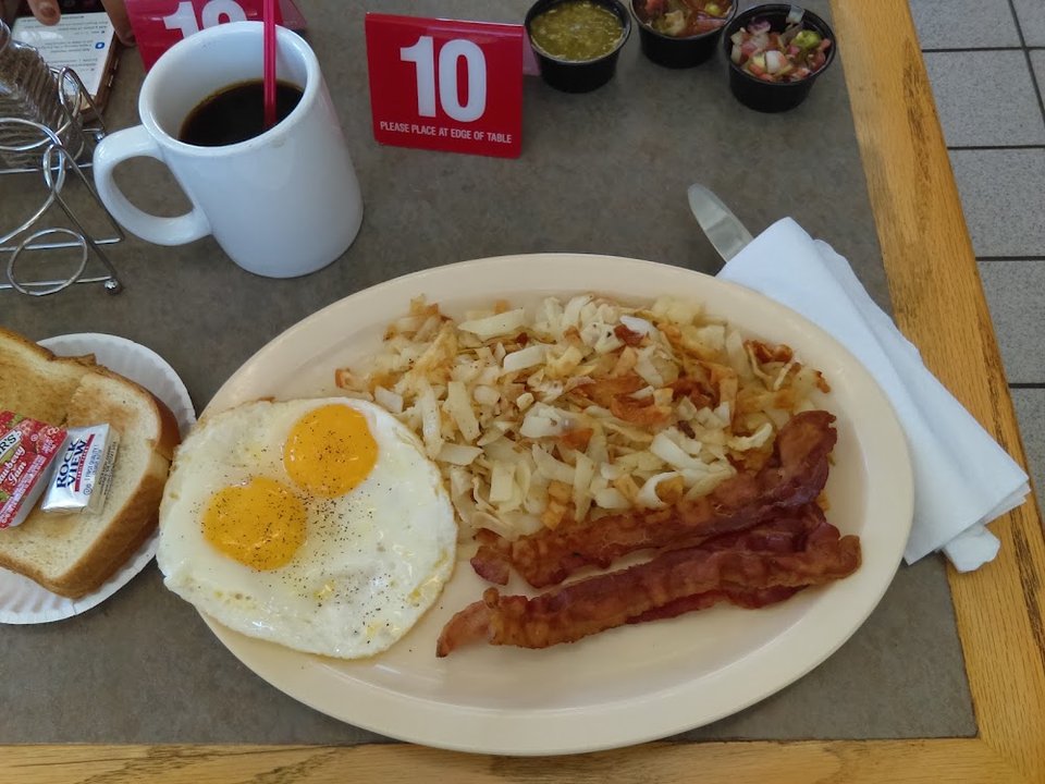 Menu board showing hot cakes and omelette options.